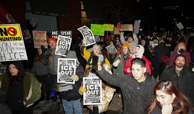 Hundreds of masked anti-ICE protesters besiege Minneapolis hotel as whistles and horns drown out streets after ICE shooting