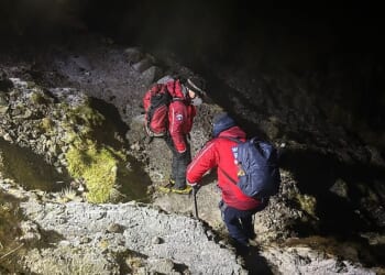 A mountain rescue team helped two young men who became stuck on Scafell Pike in 'treacherous conditions'