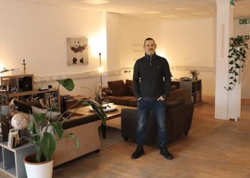 Luke Williams in his two-bedroom open-plan apartment in a disused office block in Whitechapel, east London, for which he pays £1,600 all bills included, 30 per cent less than the average monthly rent in the capital