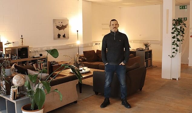 Luke Williams in his two-bedroom open-plan apartment in a disused office block in Whitechapel, east London, for which he pays £1,600 all bills included, 30 per cent less than the average monthly rent in the capital