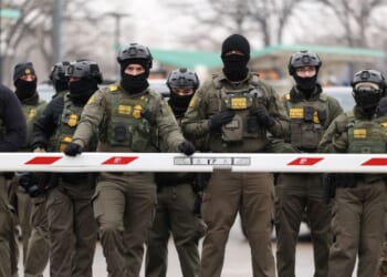 U.S. Border Patrol agents stand guard at the Bishop Henry Whipple Federal Building in Minneapolis, Minnesota, on Jan. 8, 2026.