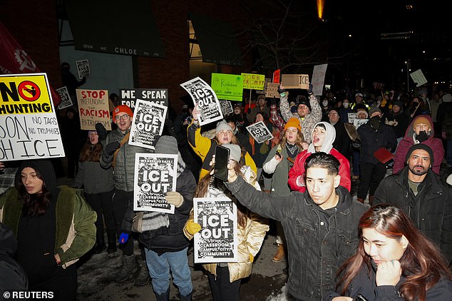People attend a demonstration against increased immigration enforcement, days after the fatal shooting of Renee Nicole Good by a U.S. Immigration and Customs Enforcement (ICE) agent, outside the Canopy by Hilton hotel that demonstrators believe is being used by federal agents, in Minneapolis, Minnesota, U.S., January 9, 2026