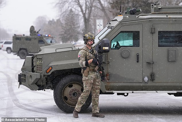 An FBI officer works the scene during operations on in St Paul