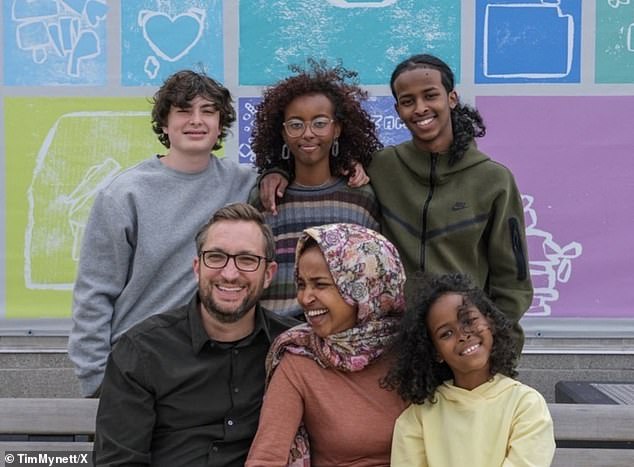 Tim Mynett and Ilhan Omar and their blended family in a photo posted by Mynett on his X feed in August 2024, with caption: 'Ilhan is a wonderful mother to our blended family. She shares her big heart (and delicious Somali cooking) every chance she gets - guiding our children with the awe-inspiring wisdom that comes from her journey'