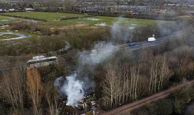Four electrical cables running to Walham substation (seen on the right of this image) were disturbed by fly tippers. The wider area - pictured last week - is covered in illegal dumps. The spot where the cables were disturbed is to the left of this image