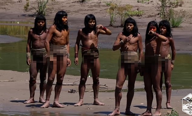 The tribesmen are shown scanning the group of Western explorers