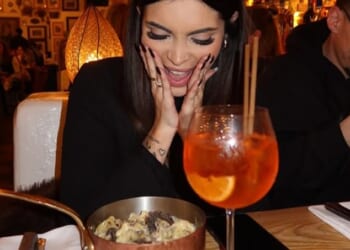 A woman poses up a storm as she enjoys an Italian dinner at one of the Big Mamma restaurants in London