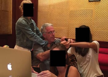 Jeffrey Epstein and a group of young women in an undated photo released by the US House Oversight Committee in December