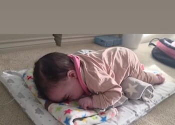 Jesy Nelson's ex-fiancé Zion Foster has praised his 'little fighter' in a sweet video of baby Story Monroe doing tummy time after her and her twin, Ocean Jade's devastating diagnosis