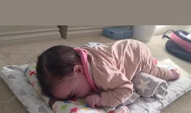 Jesy Nelson's ex-fiancé Zion Foster has praised his 'little fighter' in a sweet video of baby Story Monroe doing tummy time after her and her twin, Ocean Jade's devastating diagnosis