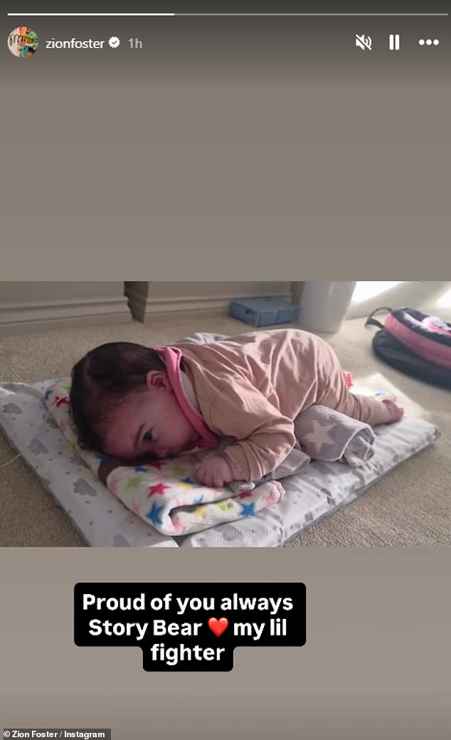 Musician Zion, 27, wrote on Instagram on Tuesday: 'Proud of you always Story Bear. My lil fighter' as his little girl wriggled around