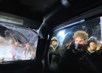 Independent journalists Nick Sortor and Cam Higby were surrounded by a mob that spray-painted their truck and smashed their windows with frozen water bottles as the two fled.