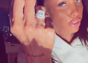 Katie Price has flashed her huge engagement ring as she kissed her new fiancé Lee Andrews after he popped the question whilst they holiday in Dubai