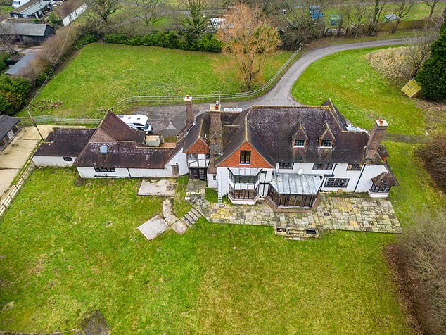 BEFORE: The former glamour model's house was pictured in a dilapidated state in January last year