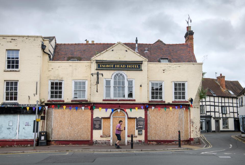 The Talbot Head Hotel in Upton-upon-Severn, Worcestershire, UK, is closed with boarded-up windows and doors.