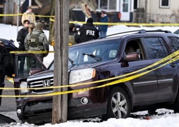 Members of law enforcement secure the scene of the shooting of Renee Good by an ICE agent after a tense exchange ending with her refusing to comply with lawful orders and pressing on the gas while he stood in front of the vehicle in Minneapolis, Minnesota, on Jan. 7, 2026.