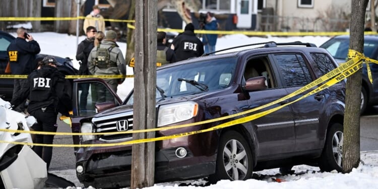 Members of law enforcement secure the scene of the shooting of Renee Good by an ICE agent after a tense exchange ending with her refusing to comply with lawful orders and pressing on the gas while he stood in front of the vehicle in Minneapolis, Minnesota, on Jan. 7, 2026.