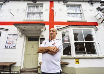 Jerry Kunkler, the landlord of Moonrakers Inn in Pewsey, Wiltshire, since 1981, painted the England flag on his pub in 2016