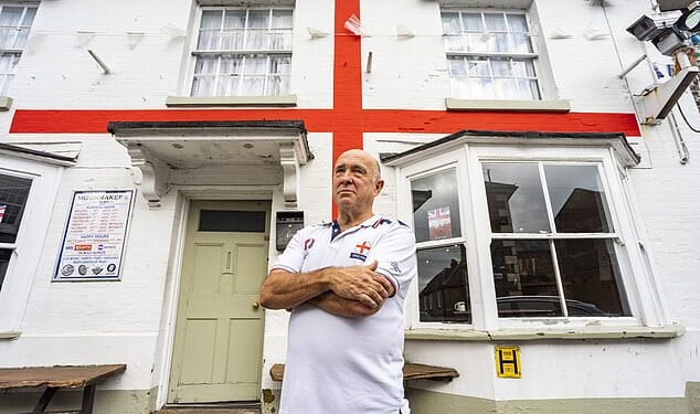 Jerry Kunkler, the landlord of Moonrakers Inn in Pewsey, Wiltshire, since 1981, painted the England flag on his pub in 2016