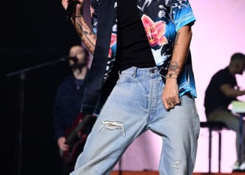 Louis Tomlinson has admitted feeling uncomfortable singing some of One Direction's 'f****g raunchy' lyrics now he is 34 (Pictured last month)