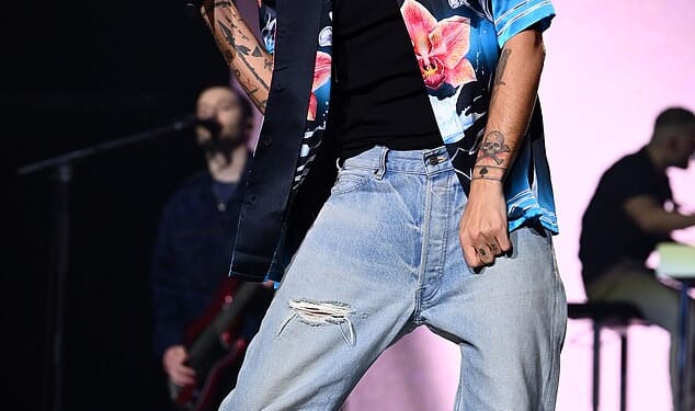 Louis Tomlinson has admitted feeling uncomfortable singing some of One Direction's 'f****g raunchy' lyrics now he is 34 (Pictured last month)