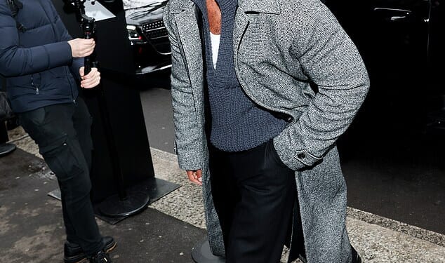 Lucien Laviscount showed off his dashing new moustache as he arrived at the Dolce & Gabbana show during Milan Fashion Week on Saturday