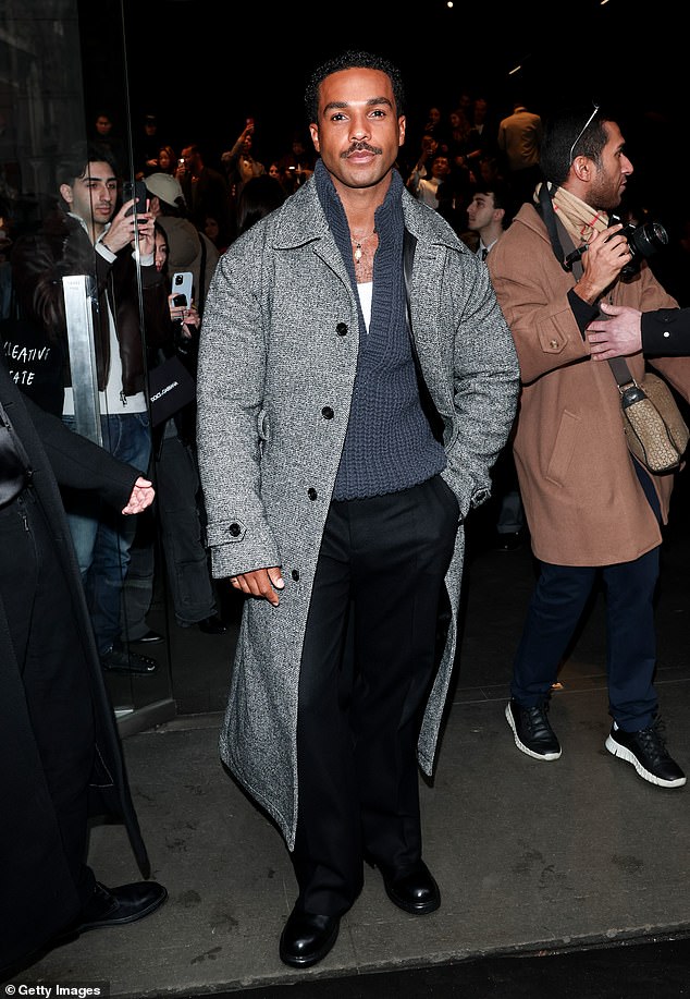 Lucien, 33, bared his chest in an oversized blue jumper and grey coat for the dapper appearance