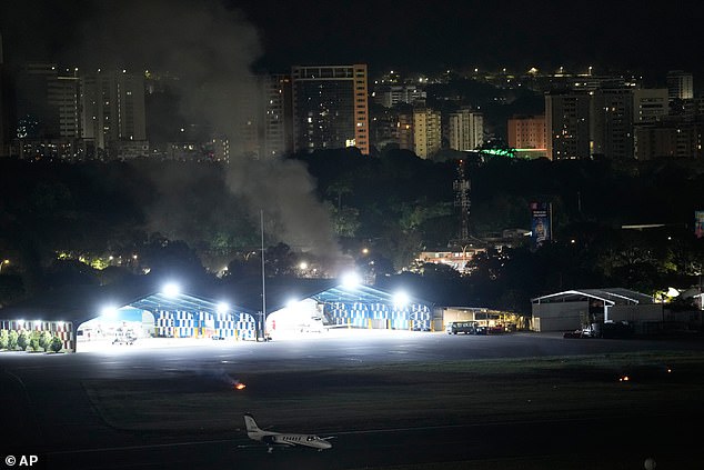 Smoke rises from La Carlota Airport in Caracas, Venezuela, after a daring dead-of-night mission by the US Army's Delta Force unit to capture the country's president Nicolas Maduro on drugs charges