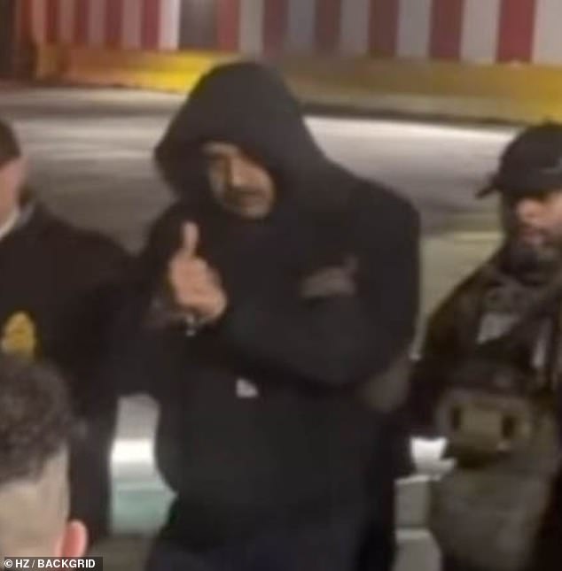 As US officials escorted Venezuelan President Nicolas Maduro out of a cavalcade of white vans, he flashed onlookers a thumbs up