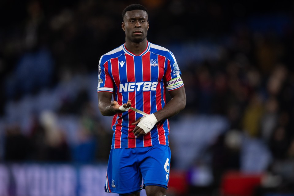 Marc Guehi of Crystal Palace looks on during a soccer match.