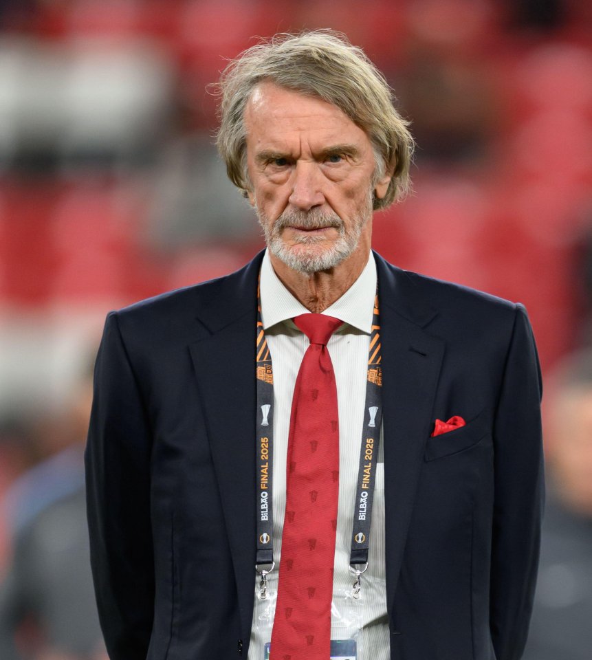 Sir Jim Ratcliffe wearing a blue suit, red tie, and a "Bilbao Final 2025" lanyard.