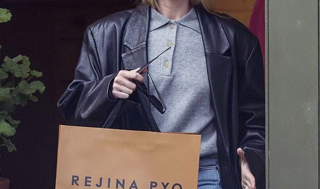 Australian actress Margot Robbie carries a bag from designer Rejina Pyo's fashion and homeware boutique in Notting Hill on January 14