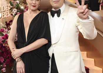 Mark Ruffalo and other A-listers honored the memory of Renee Good and protested the US Immigration and Customs Enforcement (ICE) agency on the red carpet of the 83rd Golden Globes on Sunday; pictured with his wife Sunrise Coigney