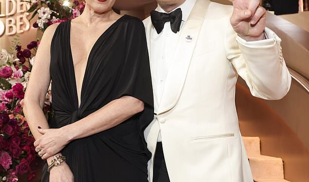 Mark Ruffalo and other A-listers honored the memory of Renee Good and protested the US Immigration and Customs Enforcement (ICE) agency on the red carpet of the 83rd Golden Globes on Sunday; pictured with his wife Sunrise Coigney