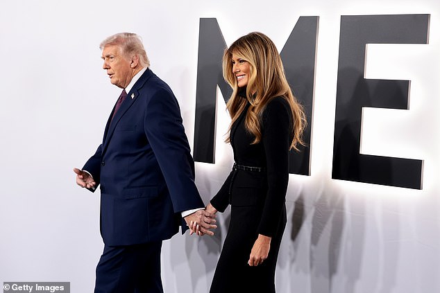 Trump, for his part, wore a navy blue suit, black dress shoes and a plum-colored tie as he accompanied his wife for her big night