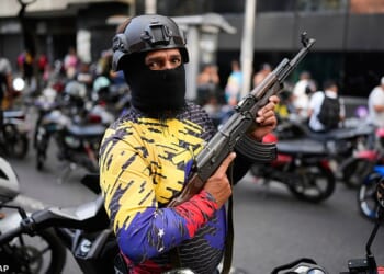 Militia men now roam the deserted streets of the Venezuelan capital in packs, as citizens fear kidnap if they leave their homes