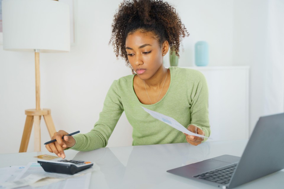 Woman calculating personal finances and bills.