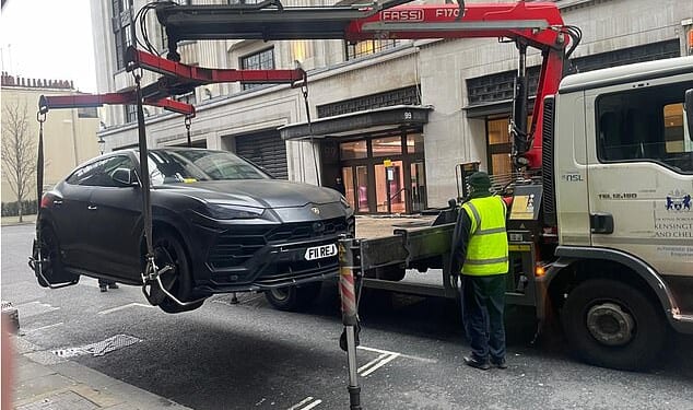 The £200,000 super car was lifted on low-loader and towed away for being illegally parked