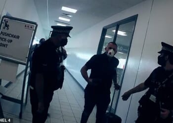 Blazej Holub is told by police he is being arrested after arriving at Luton Airport in August 2020