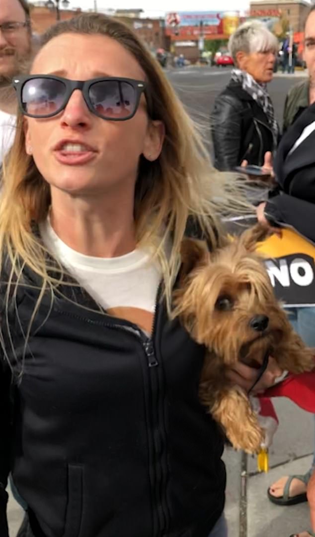 Trent filed a report of assault in connection to a video in which he clashed with a group of anti-Trump protestors, including a petite woman, carrying a small dog, who seemed to push his arm away while he was filming the altercation