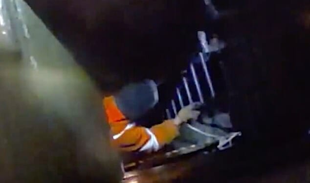 The moment a group of alleged thieves dressed as workers try to steal underground cables has been caught on camera