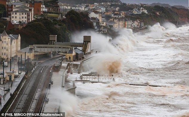 Storm Ingrid hits Dawlish train station on Saturday as high waves pound the train track with Devon taking the brunt of the high winds and rain