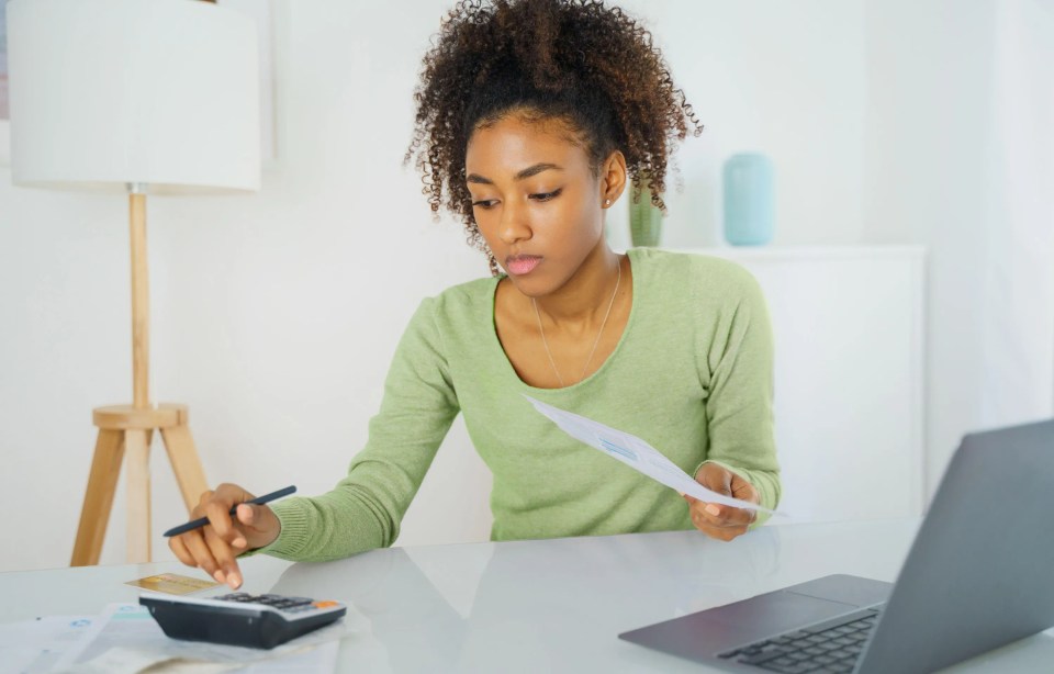 Woman calculating personal finances and bills.