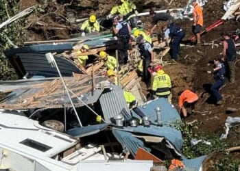 A desperate search continues for campers feared trapped after a massive landslide