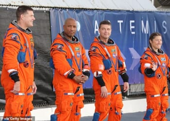 (From left to right) Astronauts Jeremy Hansen, Victor Glover, Reid Wiseman, and Christina Koch pose in their flight suits for the Artemis II mission, scheduled for February 2026