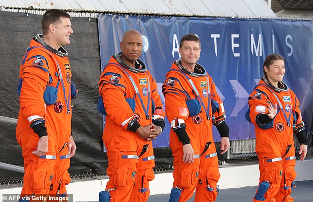 (From left to right) Astronauts Jeremy Hansen, Victor Glover, Reid Wiseman, and Christina Koch pose in their flight suits for the Artemis II mission, scheduled for February 2026