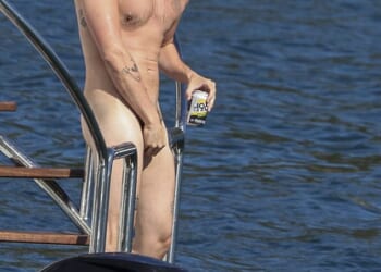 British rock star Yungblud, 28, took the term 'sun's out, buns out' quite literally as he sailed on Sydney Harbour naked on Thursday