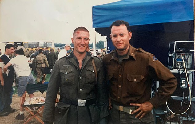 Tom Hanks, right, posing for a photo with Mike on his last day of filming