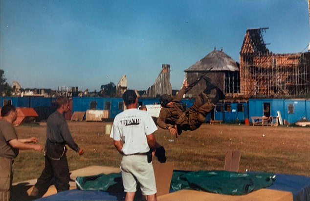 A stuntman midair practicing a move