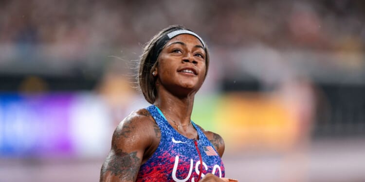 Sha'Carri Richardson of the United States celebrates at the finish line winning the gold medal during the 4x100 Metres Relay Women Final at day nine of the World Athletics Championships Tokyo 2025 at National Stadium on Sept. 21, 2025, in Tokyo, Japan.